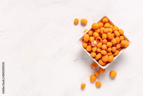 Bowl with chilli coated pea...