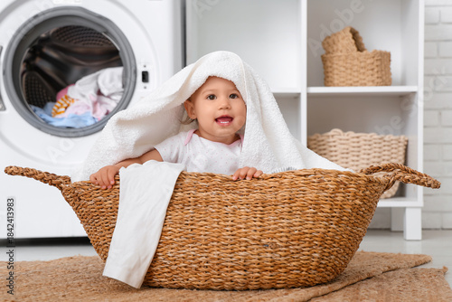 Cute little baby sitting in...