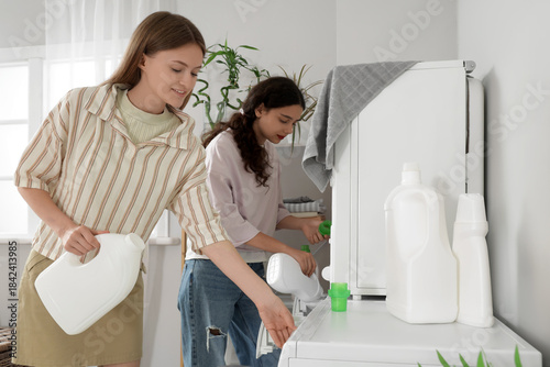Female students pouring det...