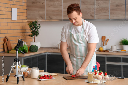 Young man with sweet cake, ...