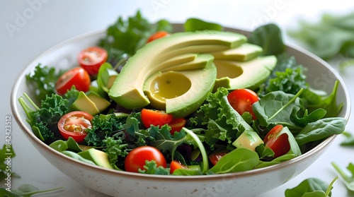 Fresh Green Salad with Avocado and Cherry Tomatoes in a Bowl