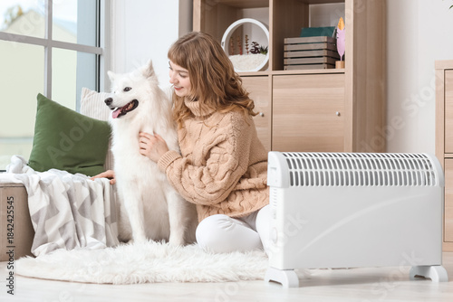 Young woman with Samoyed do...