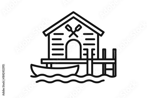 Waterside boathouse standing on a wooden pier with a small rowboat moored nearby over wavy water