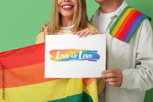 Young couple holding paper ...