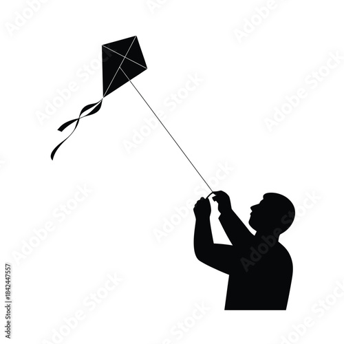 Silhouette of a person flying a diamond kite against a white background
