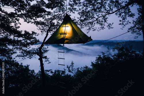 Illuminated Tree Tents Glowing in the Forest at Night, Magical Glamping Experience and Outdoor Adventure