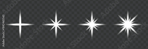 Set of four white sparkle light effects on dark transparent background