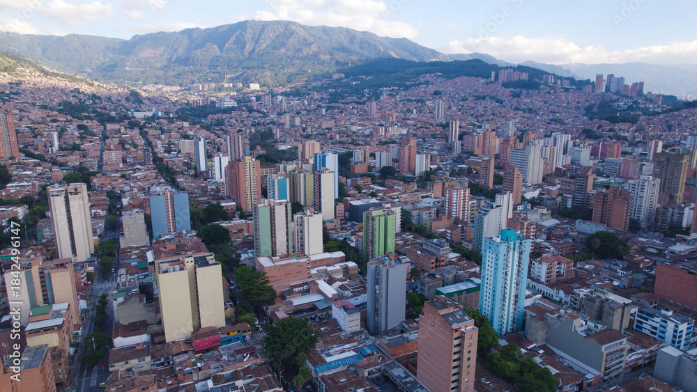 Fototapeta premium Aerial View of Medellín Skyline with Surrounding Mountains