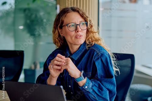 Bilde på lerret Thoughtful woman concentrating during an office meeting, brainstorming ideas, or