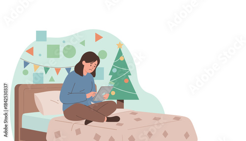 Lonely woman uses tablet on bed near a Christmas tree feeling seasonal depression or isolation