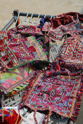 Rabari traditional national embroidery, old needlework. Beautiful embroidered bags. Folk costume, dress, Rabari tribal art. Village, India. Indian tradition, culture. Rabari tribe market, bazaar