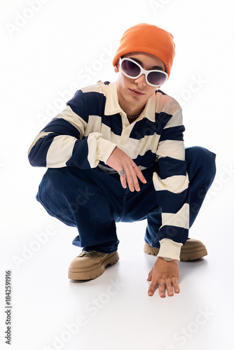 Obraz na płótnie Stylish teenager showcases unique fashion sense with confidence in vibrant outfi