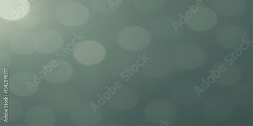 Abstract blue bokeh light background with glowing circles and winter holiday sparkle
