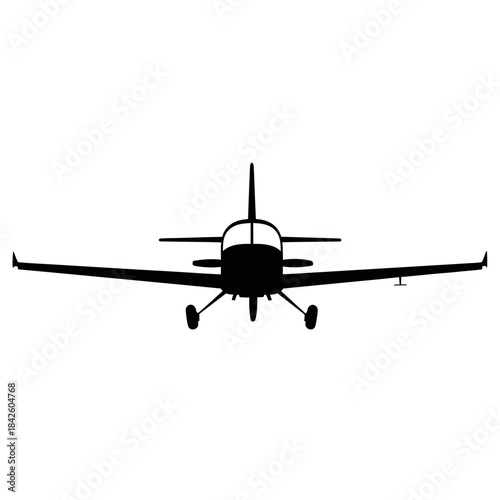 Small single engine propeller plane silhouette in flight.