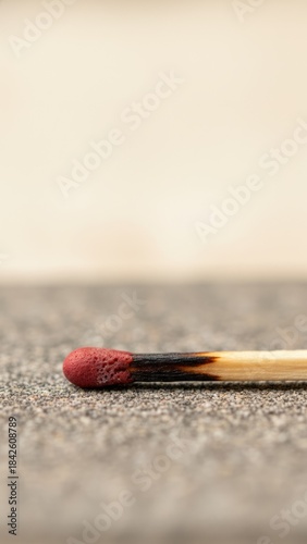 Potential Energy Concept: Unlit Matchstick on Sandpaper Texture - Photorealistic Macro Photography in Neutral Tones