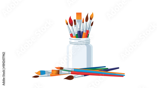 A set of colorful paintbrushes in a jar on a white surface for art and painting projects