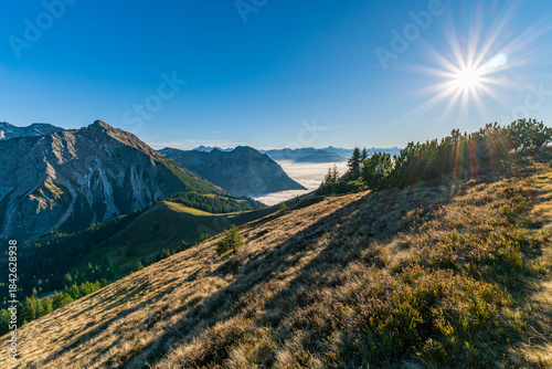 Autumn hike across the Sonnenkoepfe with magnificent views of the Allgaeu Alps