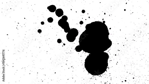 Black ink blot and splatter on a white background, dark grunge texture.