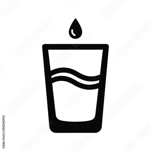 A simple glass of water with a drop falling