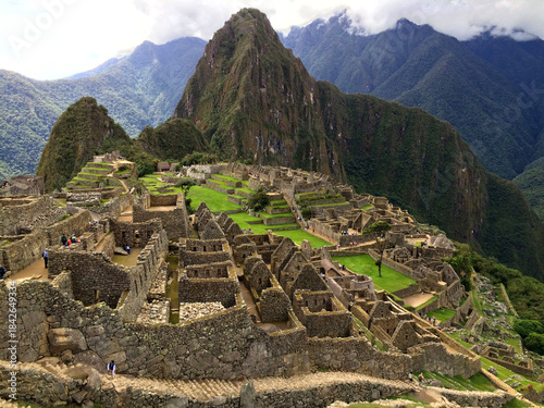 Ancient Inca citadel of Machu Picchu in the Andes Mountains of Peru featuring stone ruins and Huayna Picchu peak