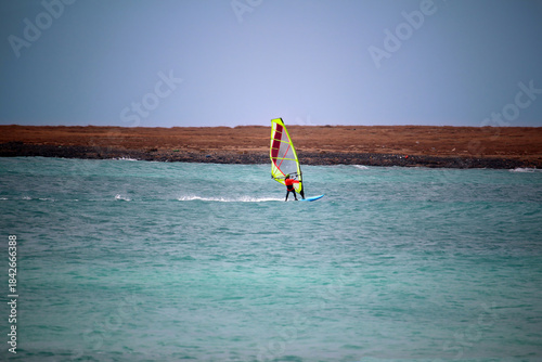 Windsurfing in the bay in front of the Sal Rei island (Boa Vista Island, Cabo Verde, Africa)