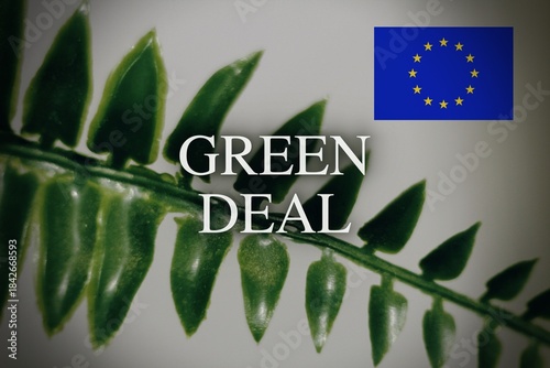 sign GREEN DEAL, blurry background leaf, sustainability, renewable energies.