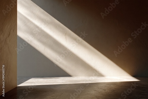 A simple, minimalist setting with natural light filtering through, creating contrast on the wall, evoking feelings of peace, calm, and serenity.