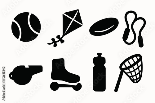 Black silhouettes of sports equipment and toys on white background