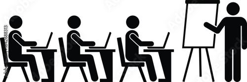 Silhouette classroom training with instructor presenting on flip chart to students working on laptops in business education session