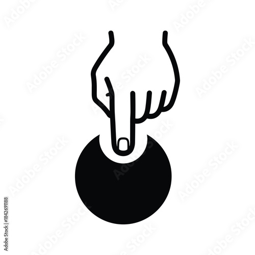 Hand touching a black circle