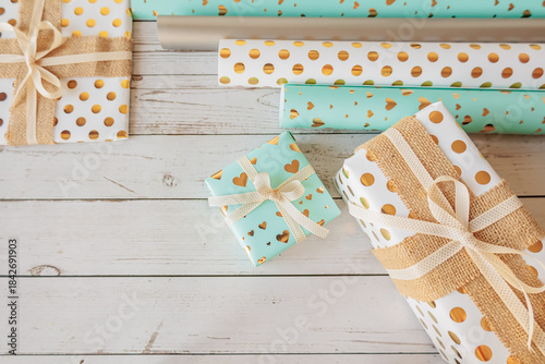 Wallpaper Mural Coordinated gift wrap set with golden hearts and dots on a white wood background. Stylish and cozy packaging flat lay for holidays, celebrations, and handmade gift ideas Torontodigital.ca