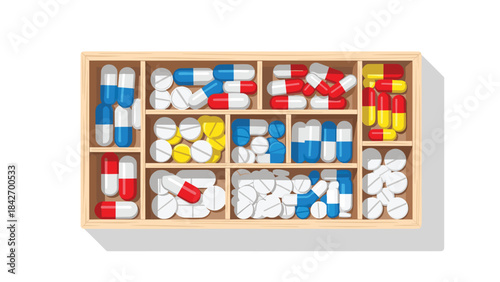 Colorful assortment of various pills and capsules in a wooden storage box