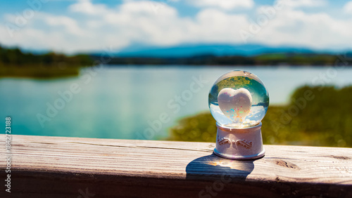 Foto Crystal ball, with a heart inside, alpine summer landscape shot near Lake Waging