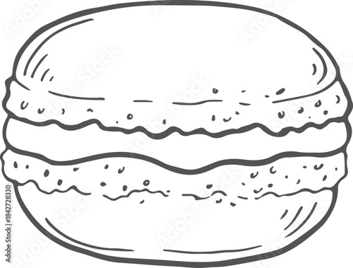 A close up of a macaron with a cream filling