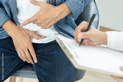 Man hold hand in front of private parts feeling discomfort and consult doctor. Venereal, testicular cancer. bladder problems, erectile dysfunction, premature ejaculation, prostate cancer