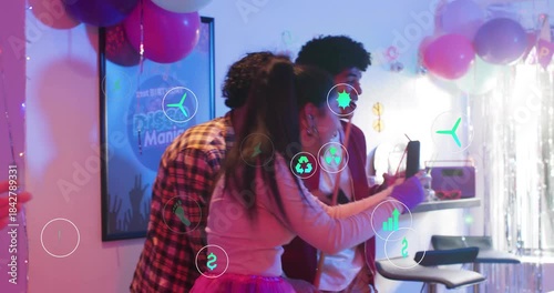 Ponytail guest tapping phone group posing at tinsel AR icons spreading to pool players for birthday