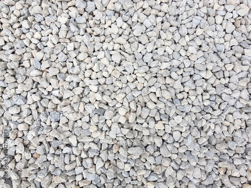 White grey small rocks texture background.