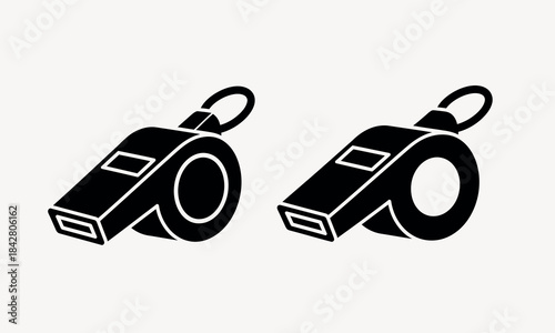 Two black and white whistles on a white background