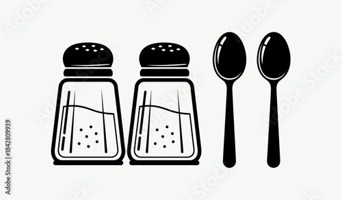 Salt and pepper shakers with two spoons