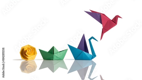 Origami paper figures rose, boats, crane, and bird in sequence