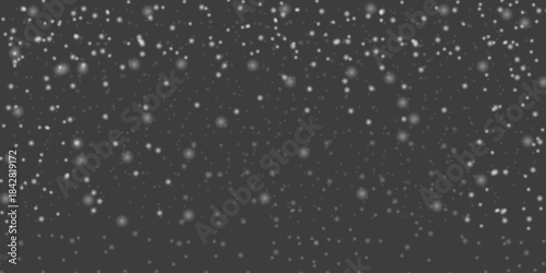 Falling snow overlay on dark background, winter weather effect, abstract motion blur