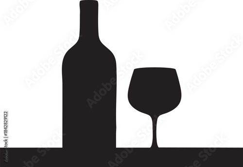 Dark red wine bottle stands beside a full glass on a black surface against a stark for elegant beverage advertising