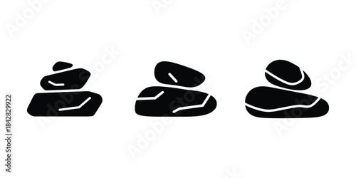 Stacked black stones silhouette on white background