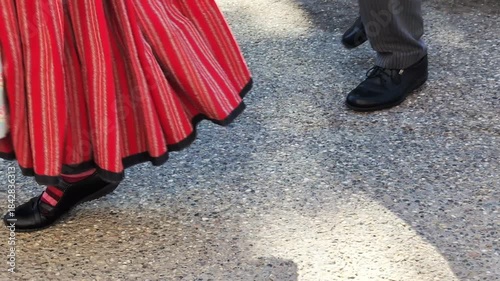 People in national alsacian costumes perform traditional dances. European culture folklore dancing