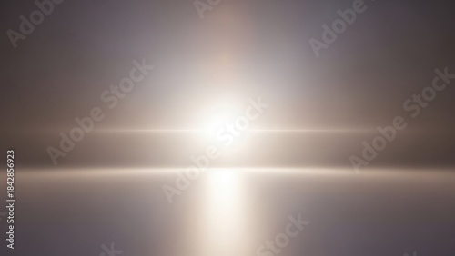Bright sun shining through a hazy atmosphere with lens flare on a gray background with light reflecting on a flat surface