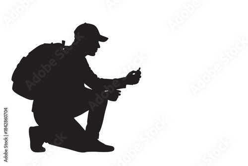 Hiker Kneeling Checking Smartphone GPS Silhouette