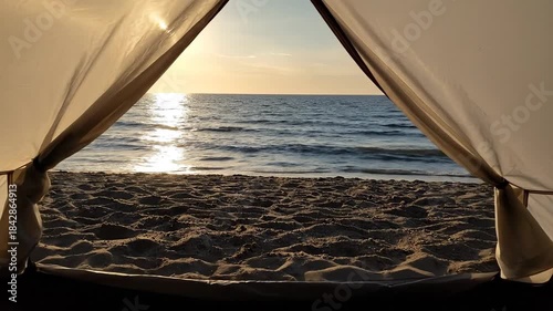 Ocean View Through Tent Opening At Sunset Reflecting Light On Water and Rocks