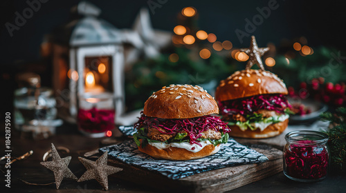 Christmas burgers with red cabbage slaw and meat patty on a wooden table. Festive holiday fast food meal with star decorations and bokeh lights background. New Year party food concept