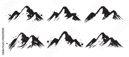 Ink brush stroke mountains set of six abstract artistic peaks with a rugged texture and dynamic splatters, perfect for graphic design elements.
