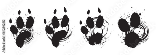 Four stylized animal paw prints with artistic ink brush strokes and grunge splatter effects create a dynamic graphic design element.